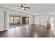 Open living space features hardwood floors, large sliding doors to the lanai, and a cozy brick feature at 14010 102Nd Ave, Largo, FL 33774