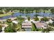 This aerial view shows lakefront homes with swimming pools and lush landscaping near a golf course at 16219 Turnbury Oak Dr, Odessa, FL 33556