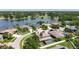 This aerial view shows lakefront homes with mature trees and lush landscaping near a golf course at 16219 Turnbury Oak Dr, Odessa, FL 33556