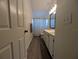 Cozy bathroom featuring a double vanity and a shower with a decorative shower curtain at 16219 Turnbury Oak Dr, Odessa, FL 33556