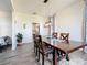 Cozy dining room featuring an elegant wooden table with gray wood-look flooring at 16219 Turnbury Oak Dr, Odessa, FL 33556