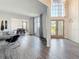 Bright and airy foyer with soaring ceilings, hardwood floors, and lots of natural light at 16219 Turnbury Oak Dr, Odessa, FL 33556