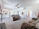 Comfortable living room with ample seating, and luxury vinyl plank flooring at 16219 Turnbury Oak Dr, Odessa, FL 33556