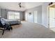 The main bedroom features vaulted ceilings, a ceiling fan, carpet flooring, and two walk-in closets at 16219 Turnbury Oak Dr, Odessa, FL 33556
