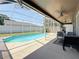 Lovely screened-in pool surrounded by a spacious patio and ceiling fans at 16219 Turnbury Oak Dr, Odessa, FL 33556