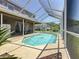 Outdoor area featuring a screened pool, patio area, and access to the home's interior at 16219 Turnbury Oak Dr, Odessa, FL 33556