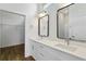 Bathroom features double sinks with quartz countertops and modern fixtures and hardware at 4344 Jaslo Ave, North Port, FL 34286