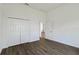 Bright bedroom with wood-look flooring and a closet at 4344 Jaslo Ave, North Port, FL 34286
