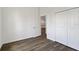 Bedroom features wood-look flooring, a closet and an open doorway at 4344 Jaslo Ave, North Port, FL 34286