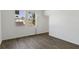 Bright bedroom with two windows and modern wood-look flooring at 4344 Jaslo Ave, North Port, FL 34286