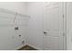 Walk-in closet with white walls, shelving unit and a wood-look floor at 4344 Jaslo Ave, North Port, FL 34286