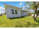 Well maintained home with stucco exterior and large lawn at 4344 Jaslo Ave, North Port, FL 34286