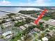 Aerial view of the neighborhood near the water and bridge with mature landscaping at 219 S Mcmullen Booth Rd # 175, Clearwater, FL 33759