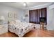 Comfortable bedroom features a ceiling fan, hardwood floors, and side tables at 219 S Mcmullen Booth Rd # 175, Clearwater, FL 33759