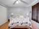Cozy bedroom features hardwood floors, closet space, and natural light at 219 S Mcmullen Booth Rd # 175, Clearwater, FL 33759