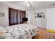 Well-lit bedroom features hardwood floors, ample storage, and a ceiling fan at 219 S Mcmullen Booth Rd # 175, Clearwater, FL 33759