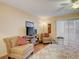 Comfortable living room offers bright natural light, laminate flooring, ceiling fan and relaxing seating at 219 S Mcmullen Booth Rd # 175, Clearwater, FL 33759