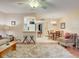 Open-concept living room showcases a kitchen view, ceiling fan, and a dining area at 219 S Mcmullen Booth Rd # 175, Clearwater, FL 33759