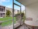 Screened patio overlooking a green lawn and the exterior of the building at 219 S Mcmullen Booth Rd # 175, Clearwater, FL 33759