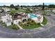 View of pool with lounge chairs, palm trees, and beautiful landscaping, close to parking at 219 S Mcmullen Booth Rd # 175, Clearwater, FL 33759