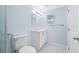 Clean bathroom with tiled floors, blue walls, and a white vanity at 3728 19Th E St, Bradenton, FL 34208