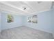 Inviting bedroom with tile floors, light blue walls, and plenty of natural light at 3728 19Th E St, Bradenton, FL 34208