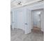 Bedroom with gray tile flooring, light blue walls, closet and bathroom access at 3728 19Th E St, Bradenton, FL 34208