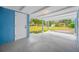 Inviting covered front porch featuring a white door and blue accent wall offers a charming entry at 3728 19Th E St, Bradenton, FL 34208