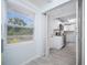 Updated kitchen with white cabinets, modern appliances, and tiled backsplash at 3728 19Th E St, Bradenton, FL 34208