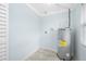 Laundry room with a gray water heater and washer/dryer hookups at 3728 19Th E St, Bradenton, FL 34208