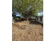 Large backyard with mature trees and space for outdoor activities at 10336 Oak Hill Dr, Port Richey, FL 34668