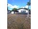 Home exterior with a palm tree in the yard at 10336 Oak Hill Dr, Port Richey, FL 34668
