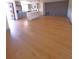 Spacious living room featuring modern gray kitchen and wood flooring at 10336 Oak Hill Dr, Port Richey, FL 34668