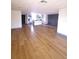 Spacious living room featuring modern gray kitchen and wood flooring at 10336 Oak Hill Dr, Port Richey, FL 34668