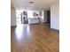 Spacious living room featuring modern gray kitchen and wood flooring at 10336 Oak Hill Dr, Port Richey, FL 34668