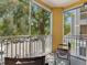 View from screened balcony shows parking and beautiful mature shade trees at 18001 Richmond Place Dr # 126, Tampa, FL 33647