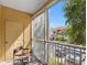 Screened balcony provides an exterior storage closet and view of parking at 18001 Richmond Place Dr # 126, Tampa, FL 33647