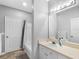 Clean bathroom featuring vanity with a sink and a mirror, plus a tub and shower combo with a stylish shower curtain at 18001 Richmond Place Dr # 126, Tampa, FL 33647