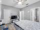 Spacious bedroom boasting with a ceiling fan and hardwood floors, complemented by ample storage and natural light at 18001 Richmond Place Dr # 126, Tampa, FL 33647