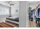 Bedroom leading into the closet with modern gray wall paint and hardwood floors throughout the living space at 18001 Richmond Place Dr # 126, Tampa, FL 33647