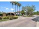 Elegant community sign, 'The Enclave', with lush landscaping and manicured grounds, nestled among mature trees at 18001 Richmond Place Dr # 126, Tampa, FL 33647