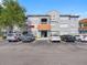 Condo building with ample parking, terracotta tile roofing, and well-maintained facade with an inviting entryway at 18001 Richmond Place Dr # 126, Tampa, FL 33647