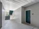 Exterior hallway leading to unit #126 with covered stairs and textured walls, offering a private entrance at 18001 Richmond Place Dr # 126, Tampa, FL 33647