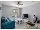 Inviting living room with a comfy blue couch, balcony access, and modern decor, perfect for relaxation at 18001 Richmond Place Dr # 126, Tampa, FL 33647