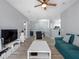 Spacious living room with open layout, wood-look floors, and neutral walls creating a cozy atmosphere at 18001 Richmond Place Dr # 126, Tampa, FL 33647