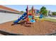 Community playground area features slides, climbing equipment, and shade at 18001 Richmond Place Dr # 126, Tampa, FL 33647
