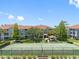Aerial view of the tennis courts, volleyball court, and a picnic gazebo at 18001 Richmond Place Dr # 126, Tampa, FL 33647