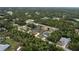 An aerial view of a neighborhood with lush greenery and well-spaced single-Gathering homes at 4146 New Milford St, North Port, FL 34288