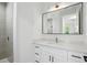 Modern bathroom featuring a large mirror, modern vanity and a step-in shower at 4146 New Milford St, North Port, FL 34288