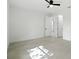 Bright bedroom featuring a ceiling fan and two doorways leading to other rooms at 4146 New Milford St, North Port, FL 34288